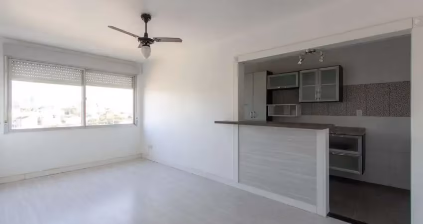 Apartamento semimobiliado à venda no bairro cristal, 2 dormitórios, 2 banheiros, 1 vaga coberta e vista livre para o guaíba