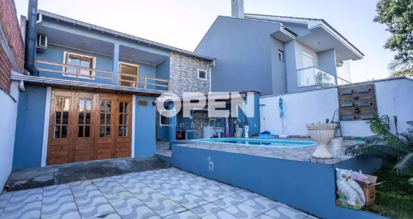 Sobrado 3 dormitórios com área gourmet, piscina e sacada à venda no bairro igara, canoas