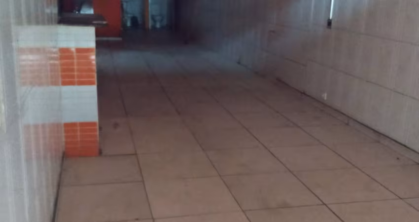 Prédio comercial com apartamento no piso superior