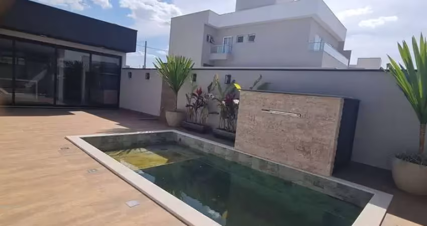 Casa térrea com 3 suítes e piscina condomínio evidencias