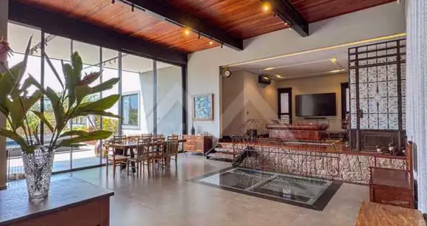 Casa condomínio com 4 suítes, garagem coberta para 3 autos e linda adega