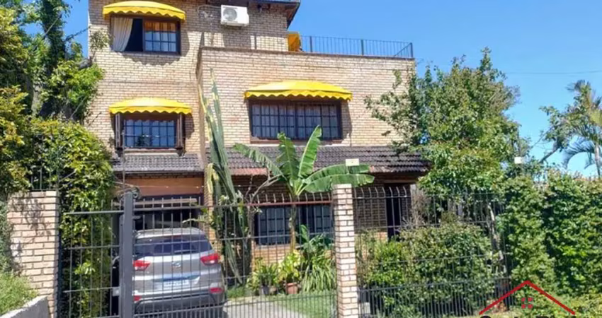 Casa com 4 quartos à venda na Rua Arapei, 325, Cristal, Porto Alegre
