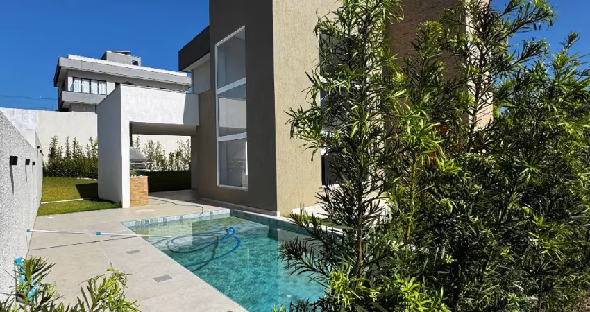 Casa a venda em alphaville litoral norte 3 com 4 suites piscina e área gourmet