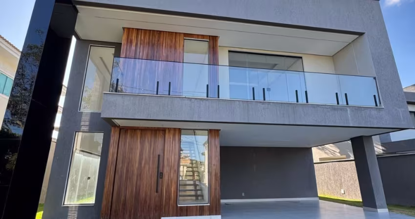 Casa a venda em alphaville litoral norte 1 com 4 suites e piscina