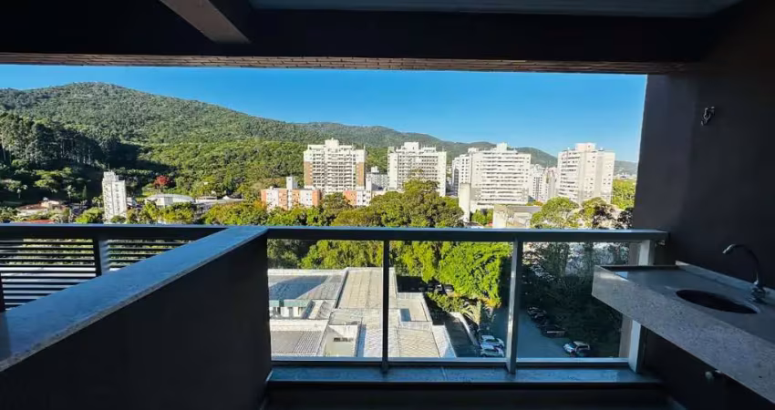 Apartamento com dois quartos sendo um suíte no itacorubi com vista para o verde.