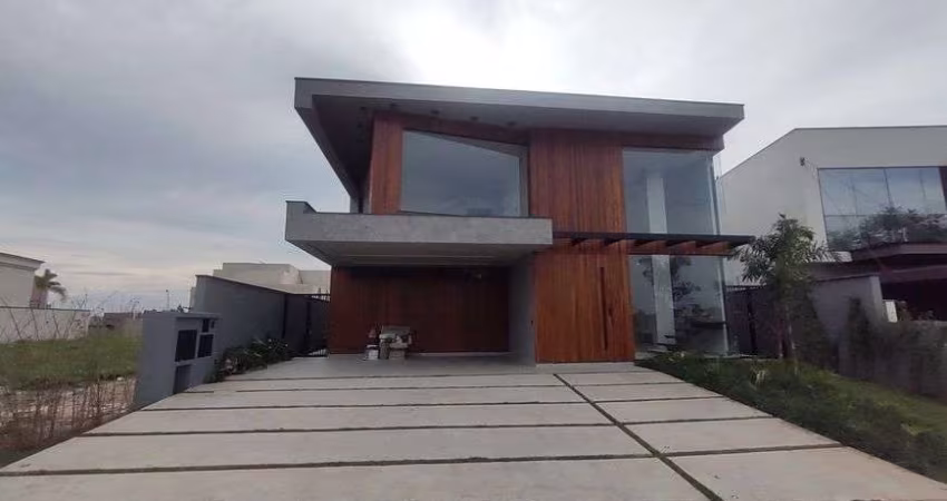 Casa de condomínio para venda possui 340 metros quadrados com 4 quartos