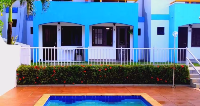 Village triplex, pé na areia