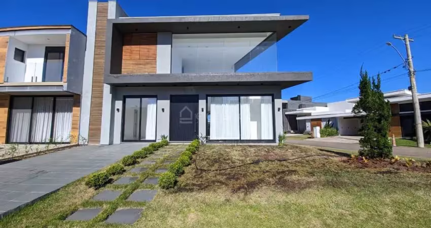 Elegante casa com 4 amplas suítes em condomínio fechado na praia de xangri-lá.