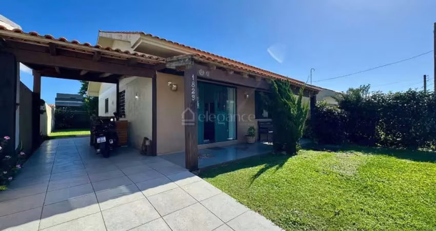 Elegance imóveis: belíssima casa térrea com 3 dormitórios, excelente padrão construtivo, localizada no centro de xangri-lá.