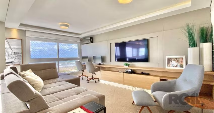 Este luxuoso apartamento de 4 dormitórios, sendo 2 suítes, oferece um ambiente sofisticado e confortável à beira-mar. Com um banheiro social e lavabo, o espaço foi projetado para atender todas as suas