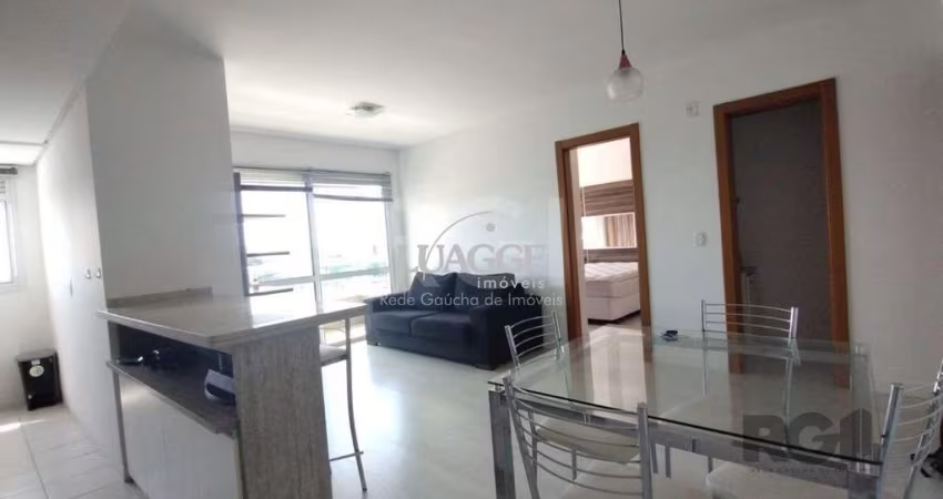 Apartamento mobiliado, 57m2, 1 suite, 1 vaga, lareira e churrasqueira, localizado no bairro Três Figueiras, Porto Alegre/RS.
