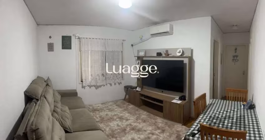 Apartamento de 2 dormitórios, living, cozinha, área de serviço e banheiro social.