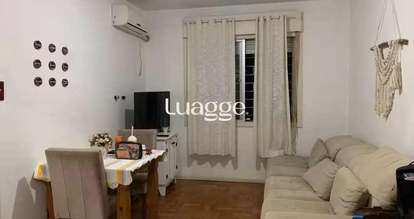 Apartamento de 2 dormitórios, living, cozinha, área de serviço e banheiro social.