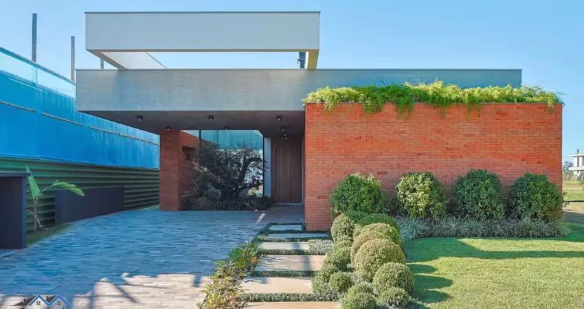 Casa em condomínio 3 dormitórios à venda condomínio reserva das águas torres/rs