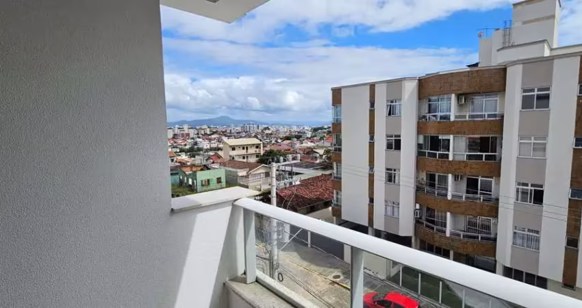 À venda em capoeiras! sacada com churrasqueira, vista mar, 3 quartos e 1 vaga de garagem.