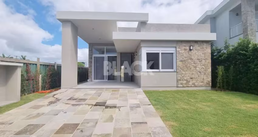 Casa térrea com 04 suítes no condomínio ilhas park em torres rs
