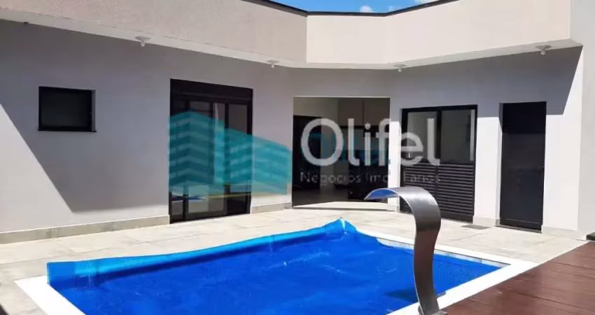 Linda casa térrea, 206m².o imóvel conta com 03 suítes com armários, sendo a suíte master com closet, escritório, lavabo, sala 2 ambientes, cozinha com armários e espaço gourmet com churrasqueira e arm