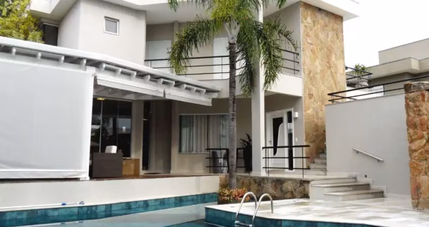 Casa à venda no alphaville campinas, 4 suítes (1 master com varanda), piscina e espaço gourmet