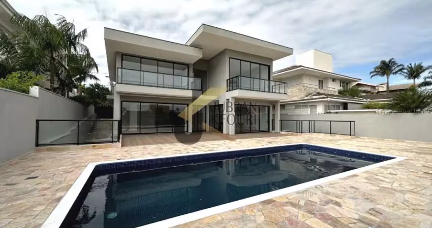 Casa para aluguel no alphaville campinas, com 4 suítes, lazer comum e garagem para vários carros.