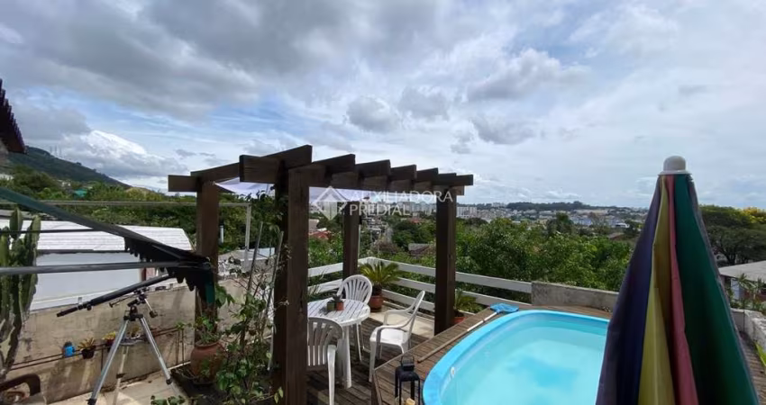 Casa com 3 quartos à venda na Rua Natércia Cunha Veloso, 267, Morro Santana, Porto Alegre