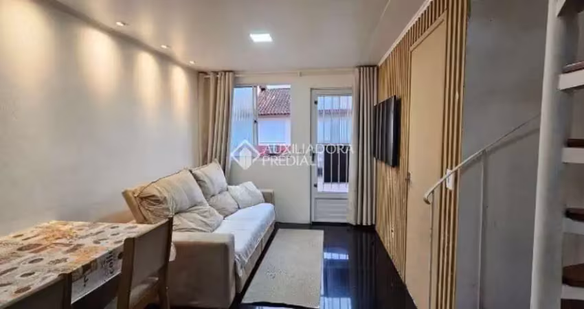 Casa em condomínio fechado com 2 quartos à venda na Avenida João Ferreira Jardim, 968, Rubem Berta, Porto Alegre