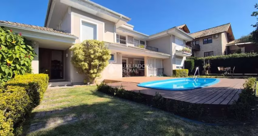Casa em condomínio fechado com 5 quartos à venda na Rodovia Doutor Antônio Luiz Moura Gonzaga, 383, Rio Tavares, Florianópolis
