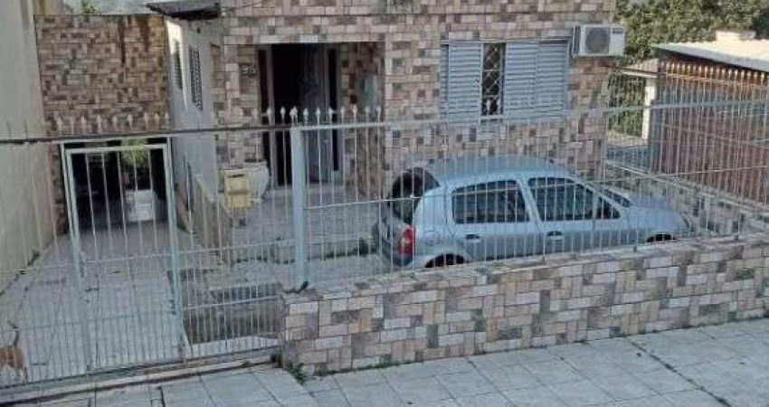 Casa em condomínio fechado com 3 quartos à venda na Rua Martim Minaberry, 395, Partenon, Porto Alegre