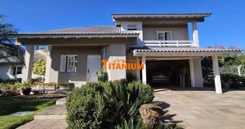 Casa à venda com 4 dormitórios, piscina, área gourmet, maravilhoso jardim no bairro ideal em novo hamburgo.