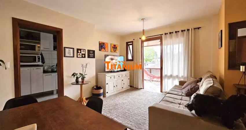 Apartamento com 2 dormitórios, sendo uma suíte, sacada aberta com churrasqueira, garagem coberta, prédio com elevador à venda em novo hamburgo.