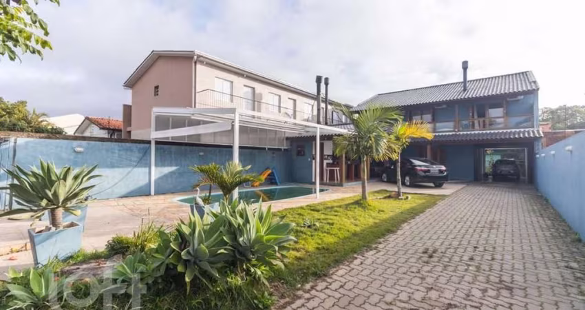 Casa com 4 quartos à venda na Rua Jerolomo Minuzo, 317, Vila Nova, Porto Alegre