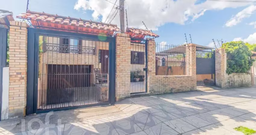Casa com 4 quartos à venda na Rua Xavier da Cunha, 581, Nonoai, Porto Alegre