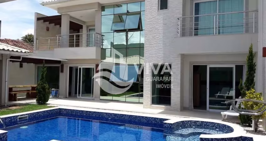 Casa composto por 3 suítes com área de lazer completa à venda na praia do morro, guarapari-es -