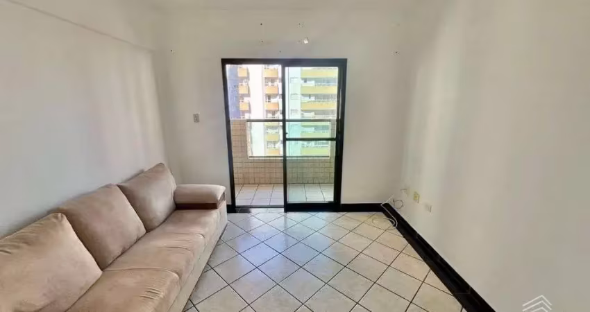 Apartamento semimobiliado 1 dormitório elevador garagem e piscina 400m da praia