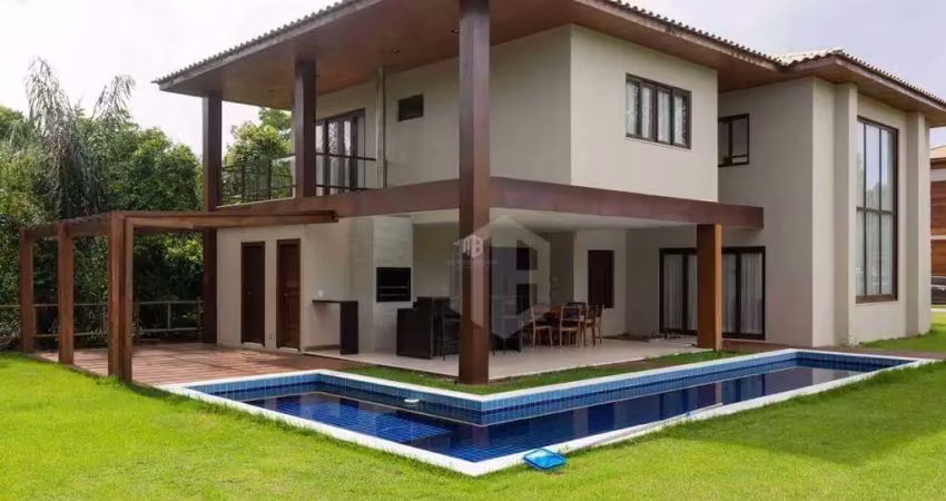 CASA A VENDA EM PRAIA DO FORTE, LITORAL NORTE DA BAHIA - Condomínio Praia Bella, acesso direto à praia, 5 suítes de alto padrão com móveis inclusos.