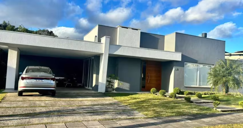 Casa no condomínio alphaville com 3 suítes e 200m² no bairro vila nova/ poa