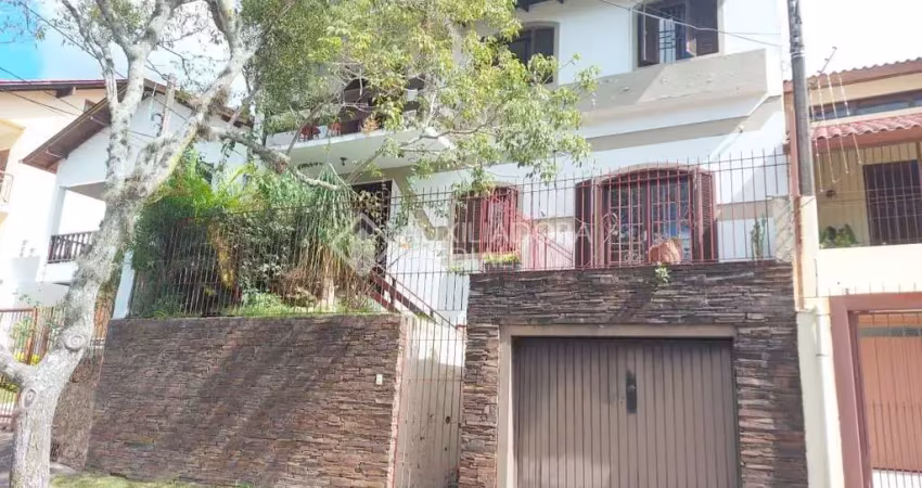 Casa em condomínio fechado com 4 quartos à venda na Rua Nero José da Silva Filho, 205, Partenon, Porto Alegre