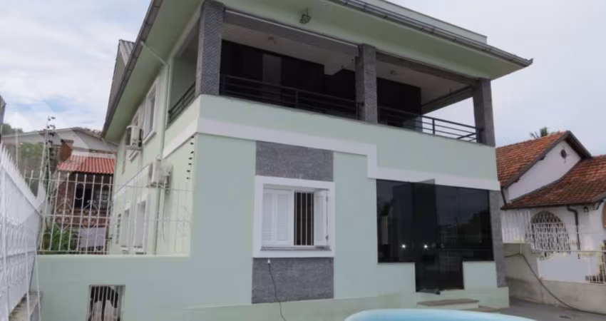 Casa com 5 quartos à venda na Rua Oscar Tollens, 98, Santa Tereza, Porto Alegre