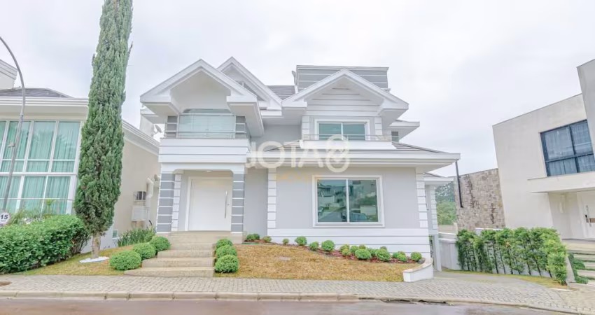 Casa com 4 suítes em condomínio - J8