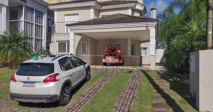 Casa com 3 dormitórios, 220 m² - venda por R$ 2.200.000,00 ou aluguel por R$ 10.178,52 - Alphaville - Gravataí/RS