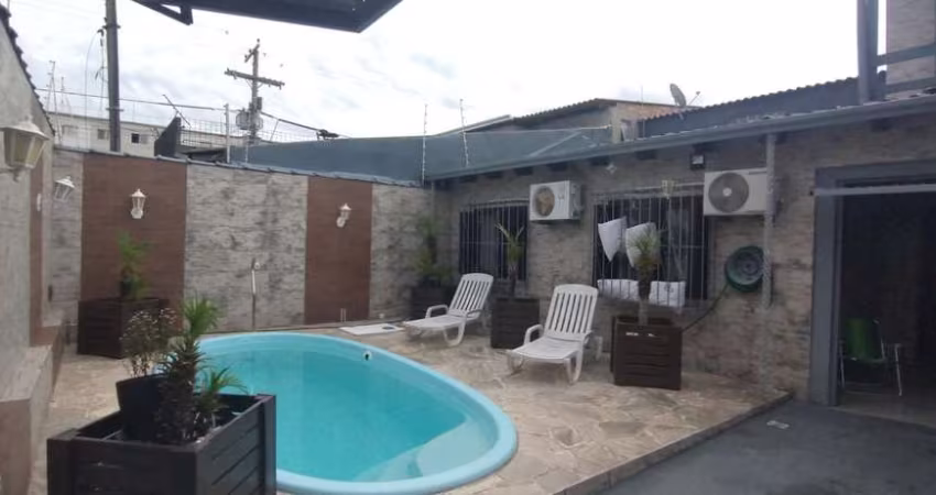 Casa no bairro Restinga com piscina com 4 dormitórios