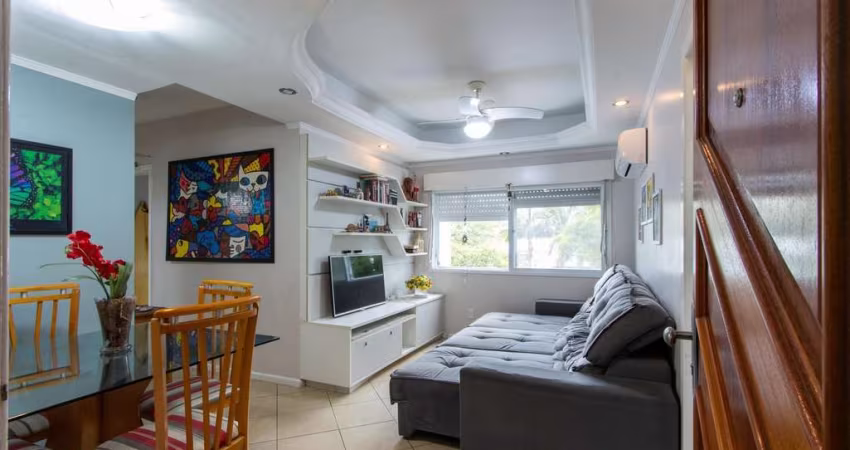Apartamento de 2 quartos, living, cozinha planejada, área de serviço e 1 vaga.