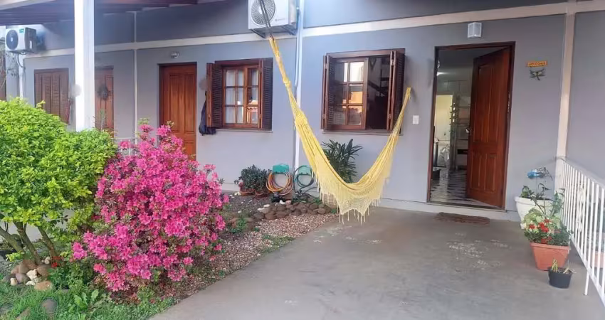 Casa com 2 dormitórios, 1 vaga, na av. otto niemeyer, bairro camaquã, poa, rs