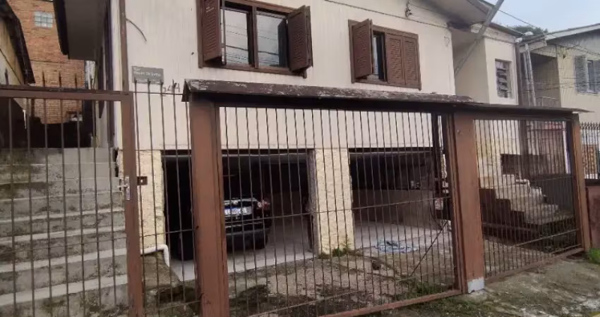 Casa mista  com 03 dormitórios , 2 vgas de garagem no bairro  rio branco