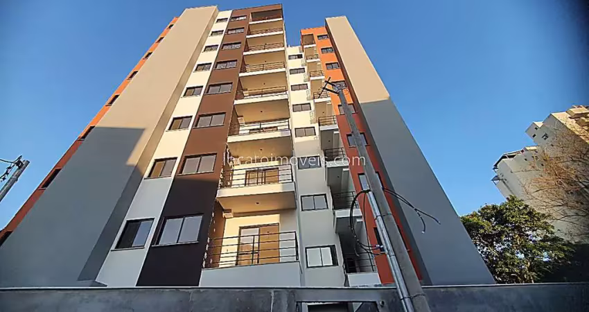 Apartamento novo 2 dormitórios, uma suíte, varanda, elevador, uma vaga - passos