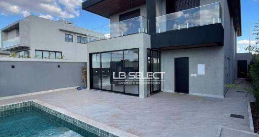Casa no Condomínio Tamboré com quatro suítes e varanda gourmet.