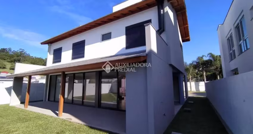 Casa em condomínio fechado com 4 quartos à venda na Rua Leonel Pereira, 2090, Cachoeira do Bom Jesus, Florianópolis