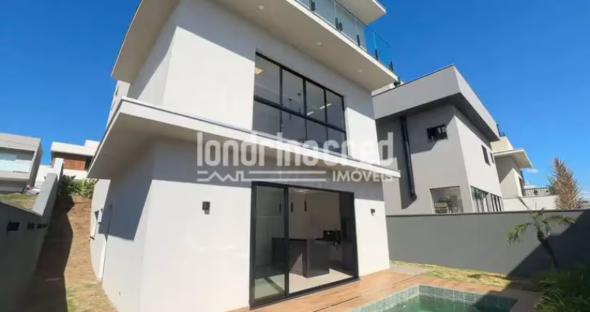 Condomínio tangará, esta casa de três andares oferece: três suítes, área gourmet, piscina, quarto a