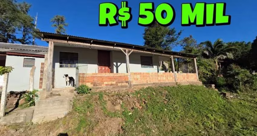 [840] CASA EM TAQUARA COM 3 DORMITÓRIOS, 2 BANHEIROS, POÇO ARTESIANO, AO LADO DA RS 020