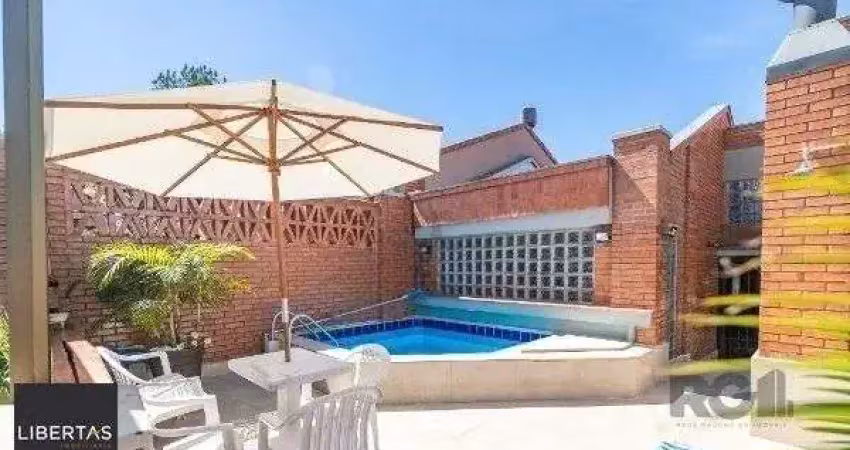 Casa em condomínio fechado com 3 quartos à venda na Avenida Jacuí, 978, Cristal, Porto Alegre