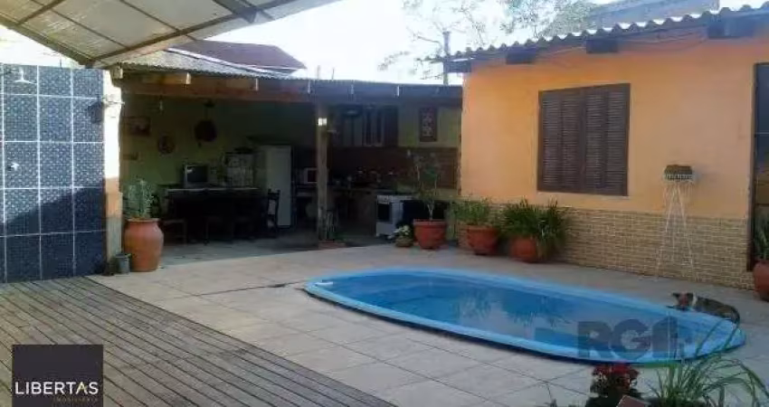 Casa com 4 quartos à venda na Rua Paulo Rubilar de Farias, 190, Restinga, Porto Alegre
